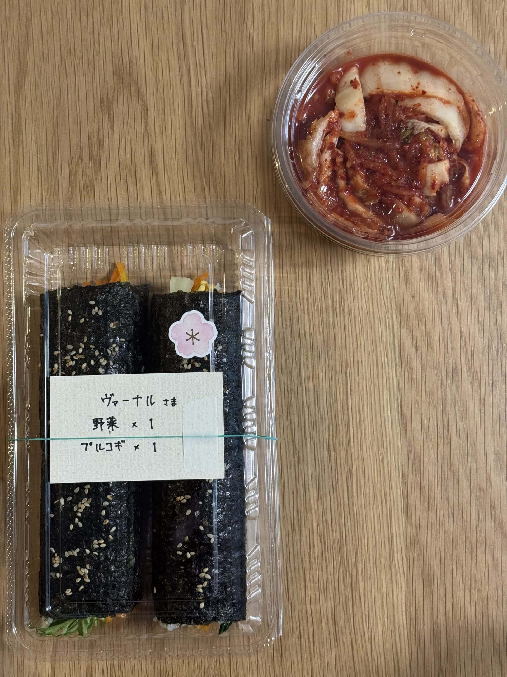 The owner graciously threw in a free additional bowl of handmade kimchi. © 2025 Norbert Woehnl Photography.