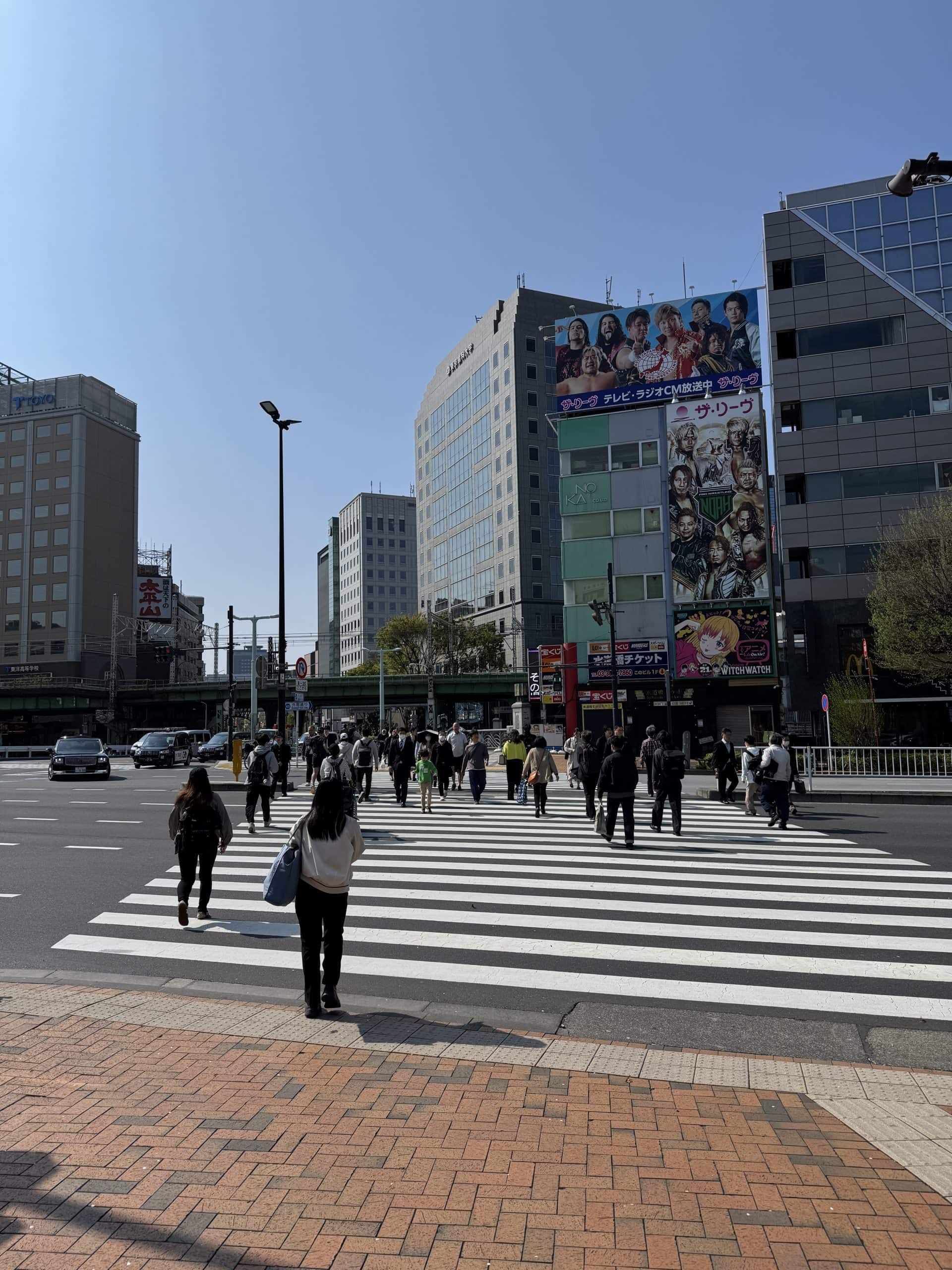 Emerging from the subway to reach this crossing towards JR Suidobashi Station. © 2025 Norbert Woehnl Photography.