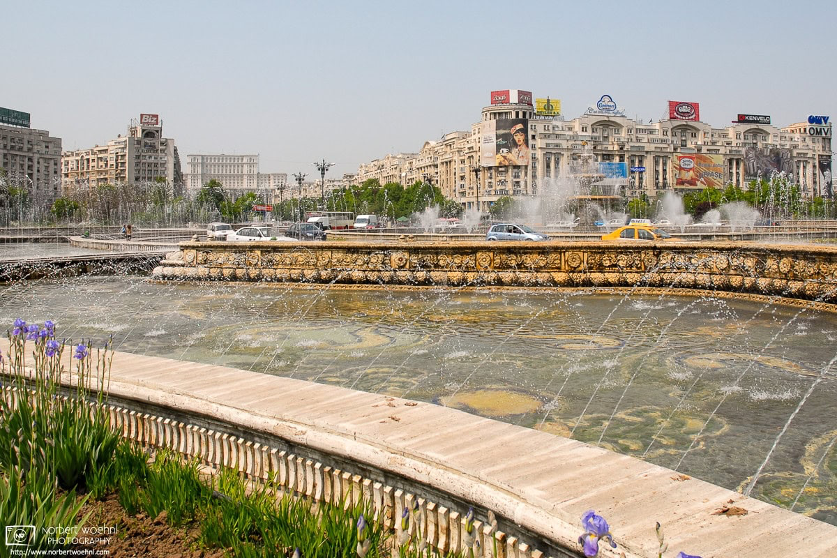 Fountain and traffic in the Piața Unirii (Union Square) area of Bucharest, Romania. © 2006 Norbert Woehnl Photography.
