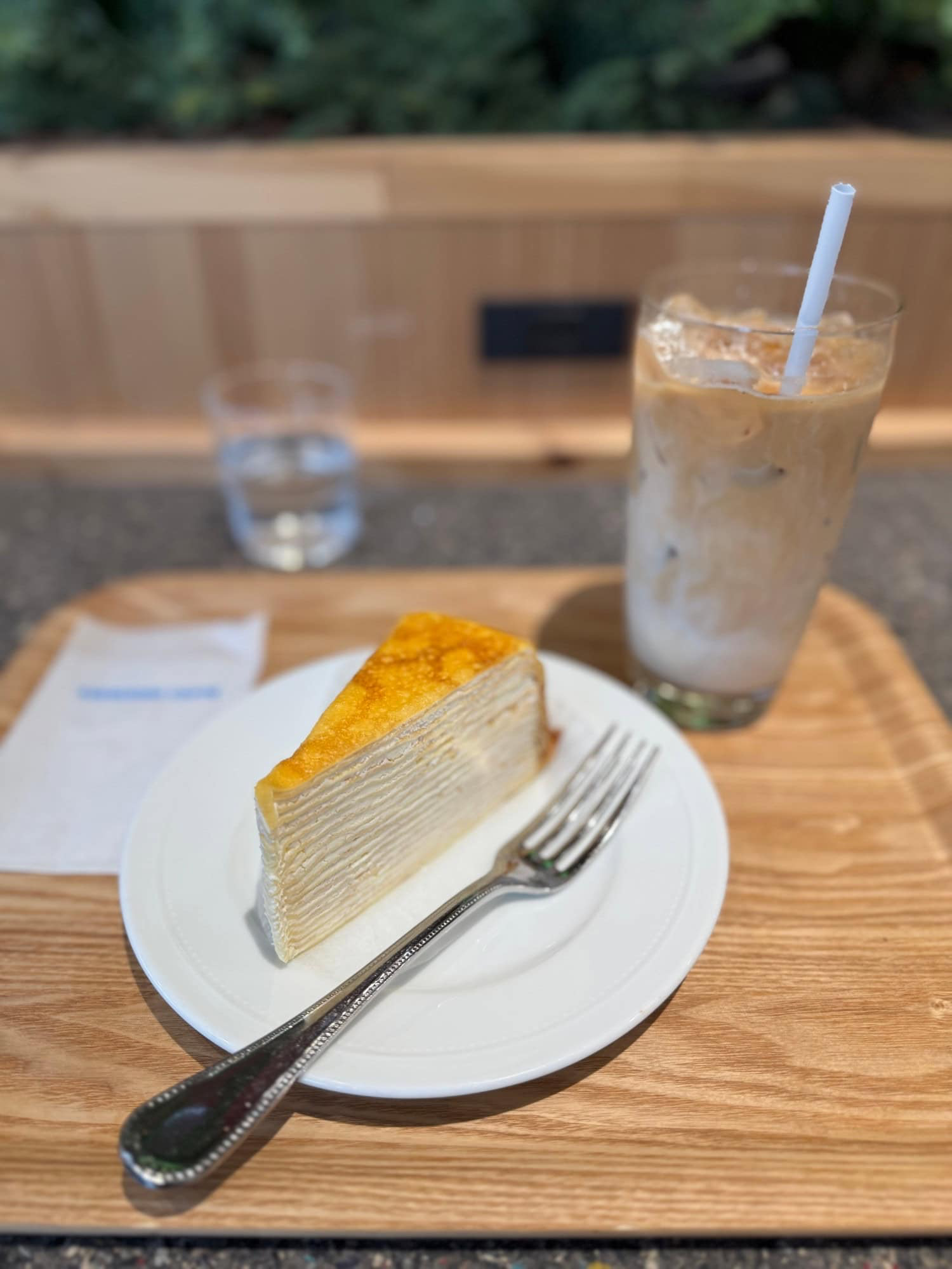Dessert: Mille-crepes and iced caffe latte. © 2025 Norbert Woehnl Photography.