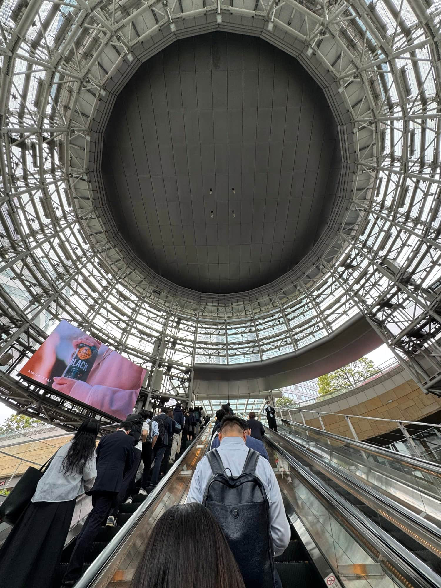 Riding up the big escalator from the subway station towards Mori Tower in Roppongi, Tokyo. © 2025 Norbert Woehnl Photography.