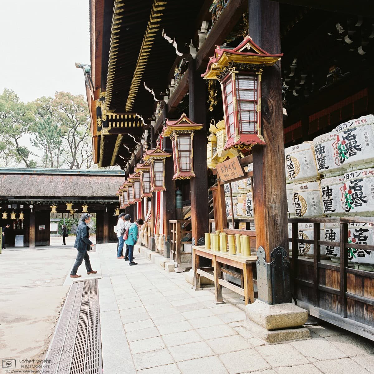People arriving for prayer at the Main Hall of Kitano Tenmangu Shrine in Kyoto, Japan. © 2016 Norbert Woehnl Photography.