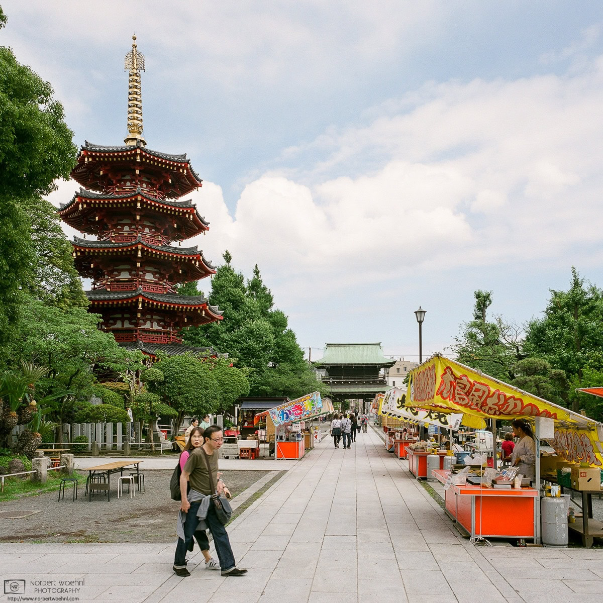 An ornate pagoda and some food stalls on the premises of Kawasaki Daishi Temple in Kawasaki, Japan. © 2018 Norbert Woehnl Photography.