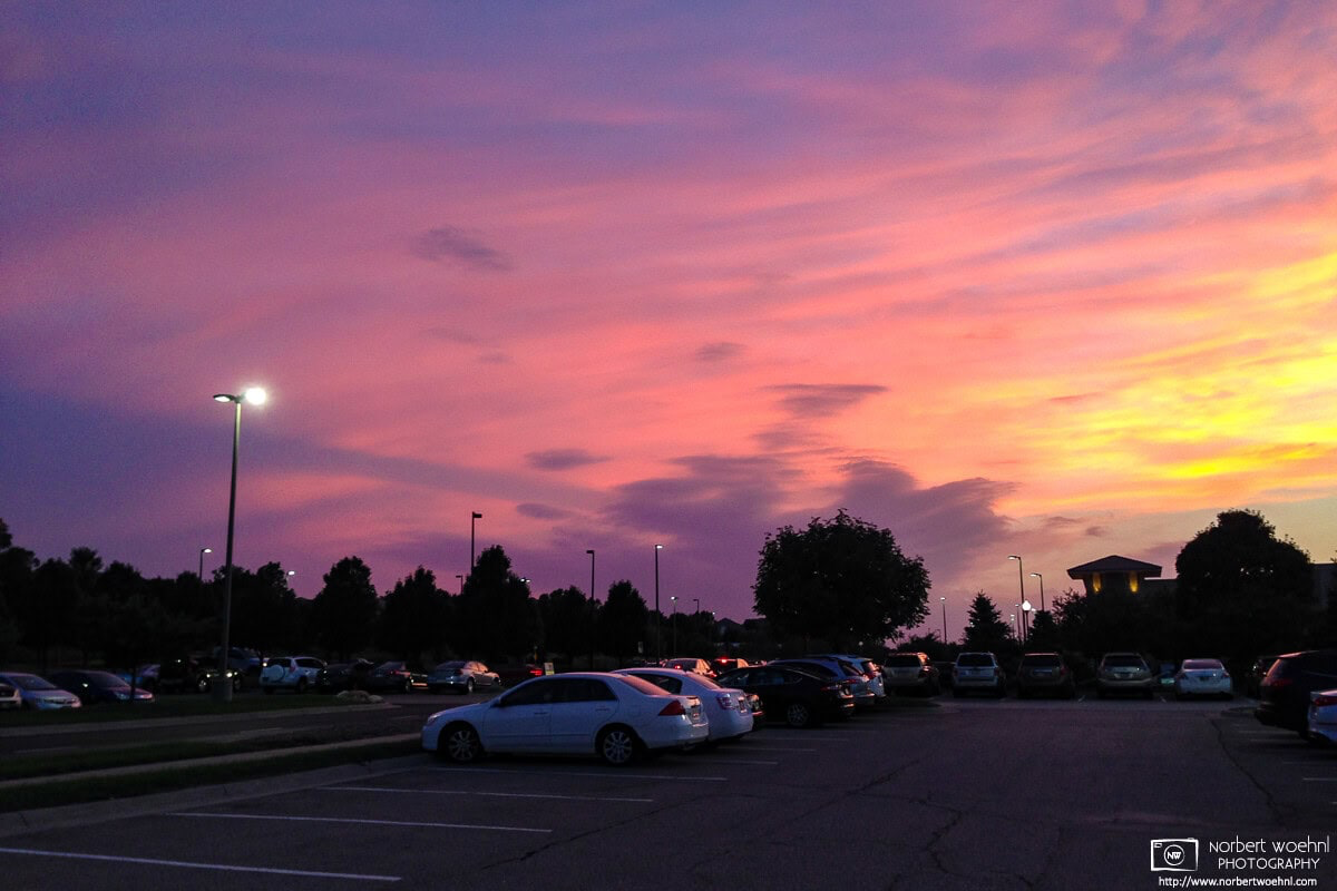 Sunset over a parking lot at Village Pointe Mall in Omaha, Nebraska. © 2014 Norbert Woehnl Photography.