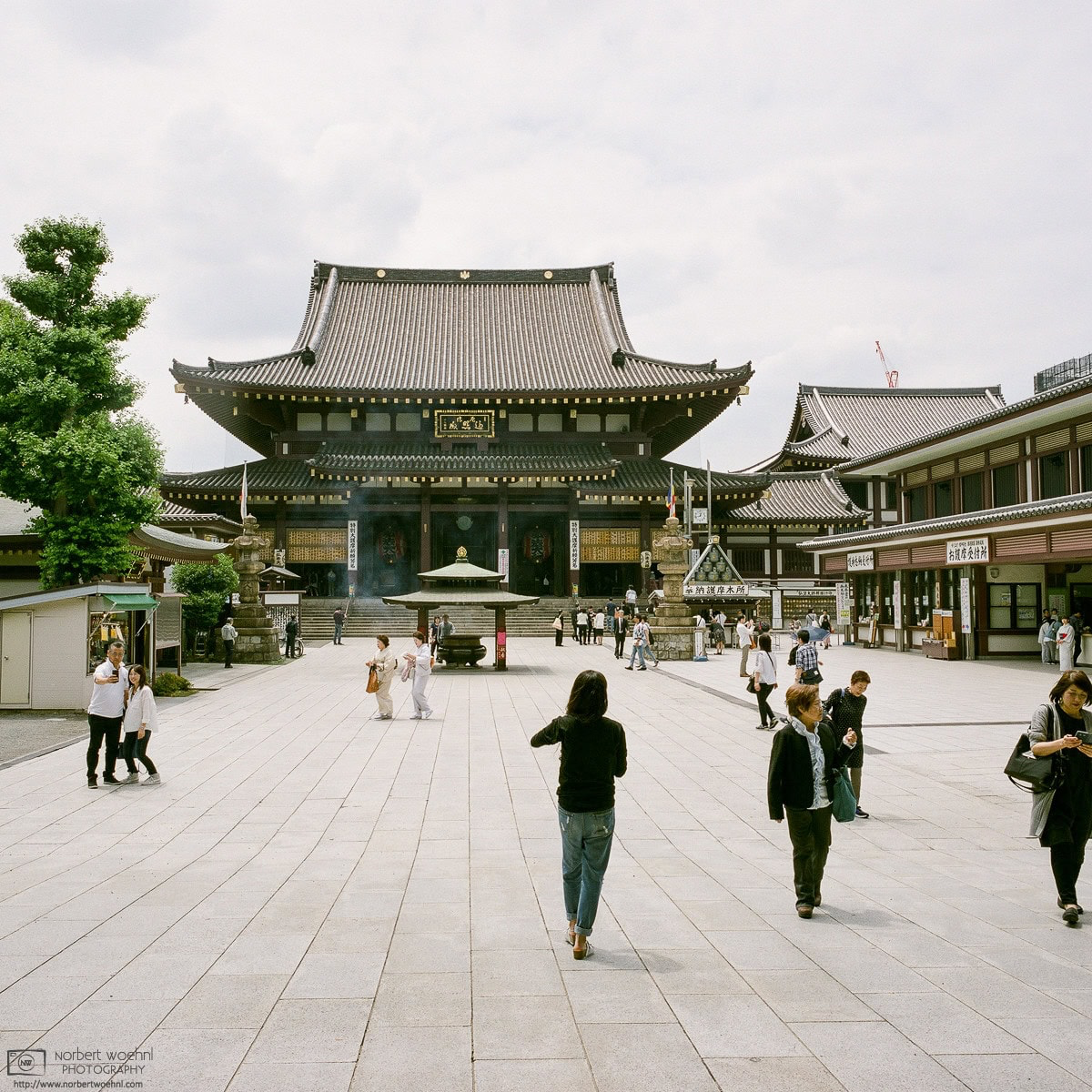 Visitors are frequenting the spacious grounds around the Main Hall of Kawasaki Daishi Temple in Kawasaki, Kanagawa Prefecture, Japan. © 2018 Norbert Woehnl Photography.